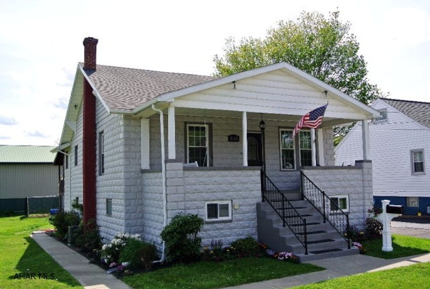 This charming 1.5 story home is much larger than it looks - some rooms reach the width of 27ft!   This home offers so much for what you would typically find in Eldorado in this price range.  Considering the oversized two car garage, covered rear deck and the extra huge open lot next to the home, you are getting a fantastic buy on this super cute home with room to expand.  This adorable home has also been updated throughout as you can see from the pictures.  With the new windows, updated baths, kitchen, and flooring, central air, and massive family room and workshop in the basement, this home won't last!  Hurry and make your appointment for your showing!!!