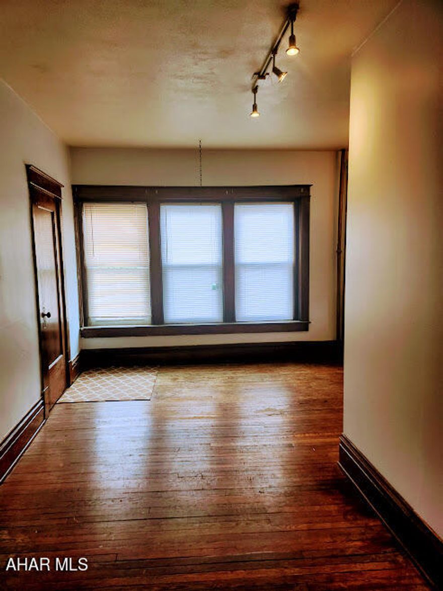 Introducing an enchanting opportunity! This spacious and charming second-floor unit is now available for rent in Bedford Borough, Bedford, PA. Offering the flexibility of either 1 or 2 bedrooms, along with a full bathroom that includes a luxurious soaking tub but lacks a formal shower. The unit is unfurnished, providing the perfect canvas for you to add your personal touch and create a space that truly reflects your style. Notably, a delightful sunroom adds an enchanting touch, offering a cozy and inviting atmosphere. With its generous size and desirable location, this rental unit is truly a special place to call home. Don't miss out on this captivating opportunity!