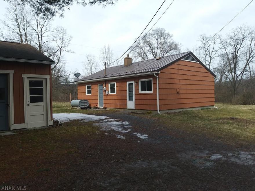 Freshly cleaned, painted and updated cozy cottage in Bedford. Set on a private 1.3  acre lot with woods surrounding the property lines. Walking distance to town but with a very quiet setting. 1-car detached garage. Interior and exterior of home have been painted, new windows and new roof installed on house.