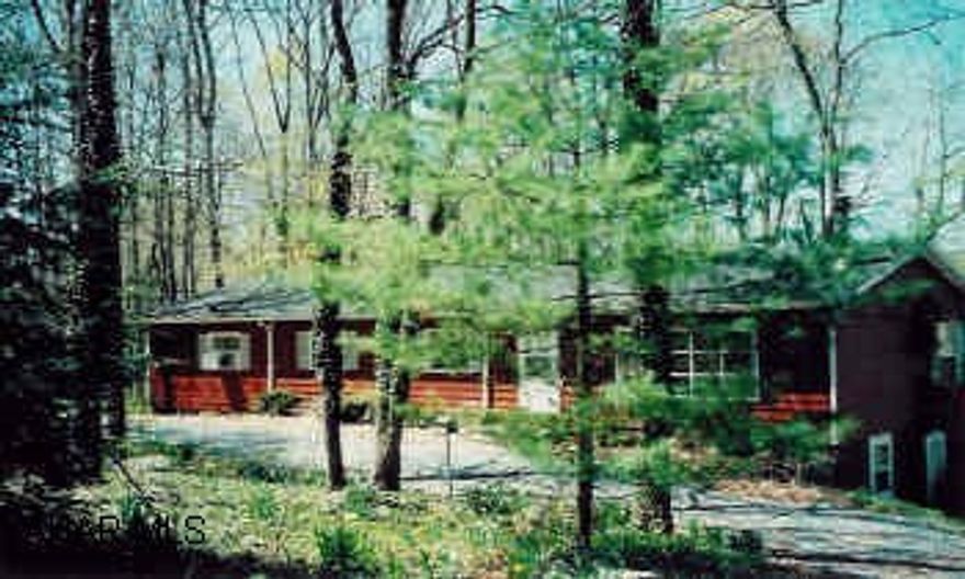 Lovely Ranch surrounded by trees, borders Dunnings Creek. 2 car detached heated garage. rear deck, wooded, private picnic area