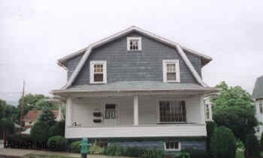LIVING ROOM WITH FIREPLACE. SEP. DINING ROOM WITH CORNER CUPBOARD. NICE WOODWORK.