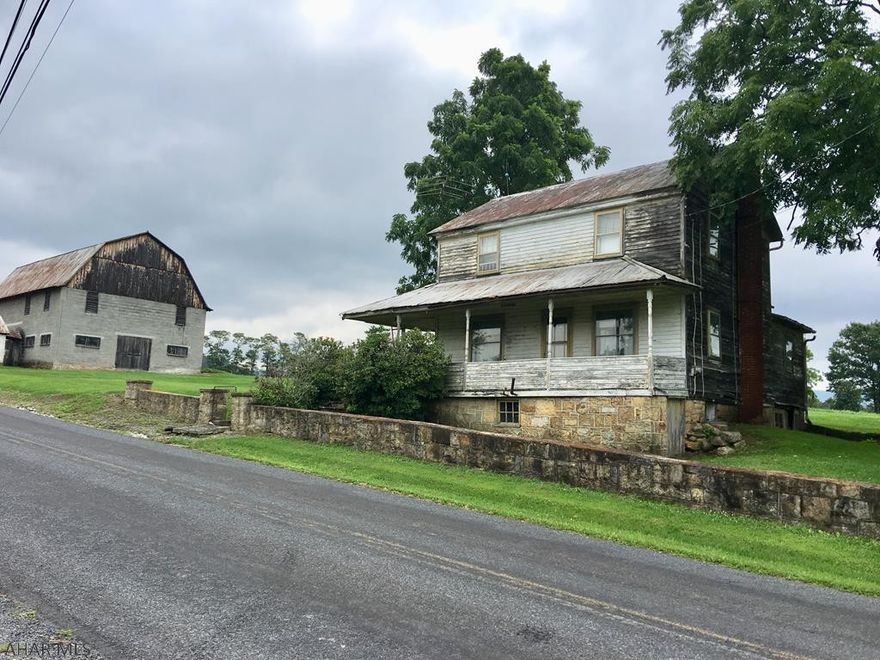 Looking to start you own farm?  This is the property for you!  Approx.  8 acres of fields and approx. 20 acres of woods! Beautiful views of the mountains and a stream on the property.  A 30x50  barn great for storing hay and equipment and a 14x18 milk house.  The home was built in the 1900's with needed repairs.  The porch around the home will need repaired or replaced.  Property is being SOLD "AS IS WHERE IS".  It is unknown where the septic and well are located.  They are not in working condition.