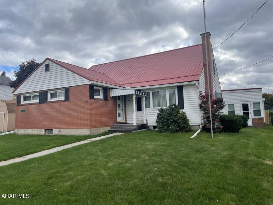 Portage- 3 BR, 1 3/4 Bath brick & vinyl sided cape cod on 60' x 130' level lot.  Spacious kitchen & first floor bedroom.  Powder room & office.  Gas, hot water BB heat.    Newer metal roof & windows.  Enclosed breezeway/sunroom.  Full unfinished basement.  2 car attached garage.
