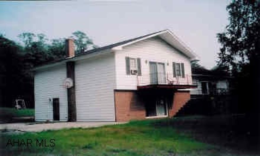 3 Bedroom Raised Ranch on 8.113 acres, detached workshop.