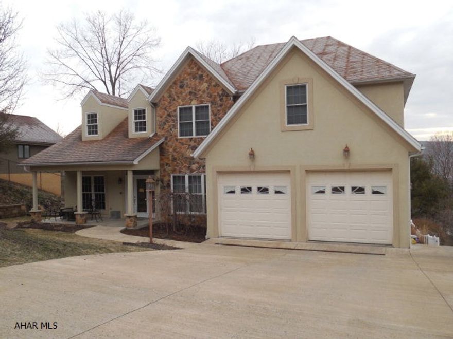 This gorgeous 5 bedroom. 3.5 bath contemporary home has quality workmanship throughout. Kitchen with  custom concrete counters andnew stainless steel appliances. Great room with corner fireplace and French doors that lead out to a trex deck with a tremendous view plus overlooking an inground heated pool. Masterbedroom with tray ceiling, two large walk-in closets. Master bath with  custom concrete counters,porcelain tile floor, steam shower and whirlpool tub. Finished lower level with wet bar, bath and 2 bedrooms. Tremendous area for entertaining. To view Visual Tour go to top of page to listing tool and click on movie reel.