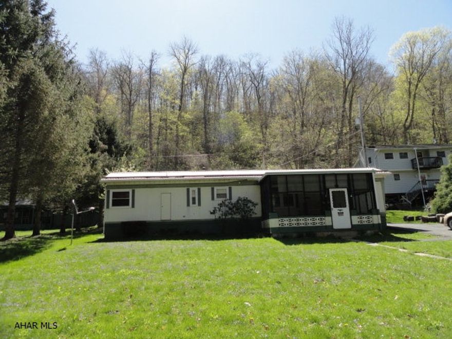 Relaxing cottage, w/75' of accessible river frontage, located in the Newton Hamilton area of Mifflin County. Excellent fishing, good river quality & abundant wildlife. One story, 2 bedrooms, 1 bath with double vanity, laundry w/washer & dryer & loads of storage. Large screened porch, rear patio w/picnic table, garden & 3 sheds, one with workshop. Everything you need for year round recreation---fishing, hunting, canoeing, kayaking, innertubing, biking and birding; plus the Tuscarora State Forest is near-by. Don't miss out owning this peaceful river retreat. They don't come up often....Most properties like this remain within families. Great opportunity! Actual address is 220 Wharton Road, McVeytown, PA 17051.