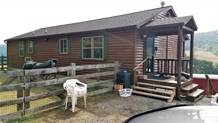This log sided cabin has been meticuously maintained.  It features pine flooring with T&G pine walls and ceilings throughout.  the kitchen contains a dining area.  It features 2 spacious bedrooms and two full bathrooms.  Enjoy beautiful views of the mountains from the covered porch.