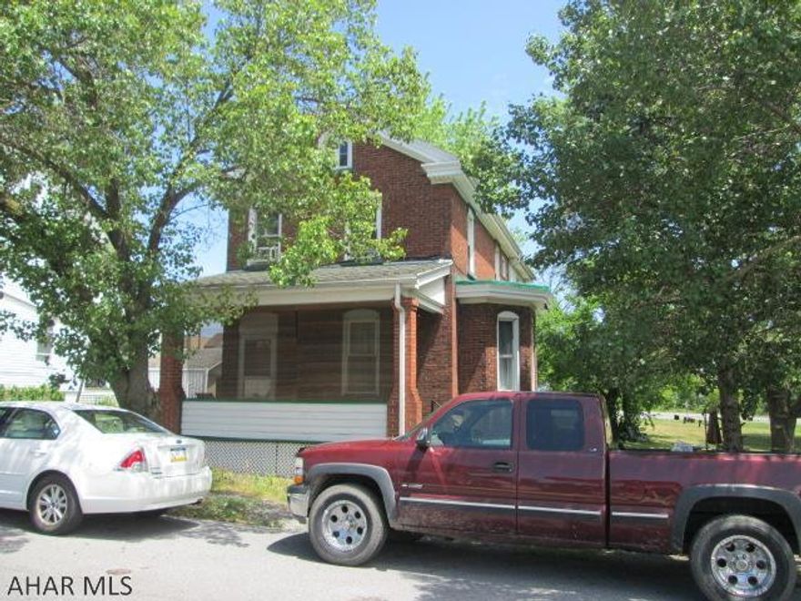 Huge reduction for this  property. Brick two story that is part of a commercial opportunity. Currently used as a rental.