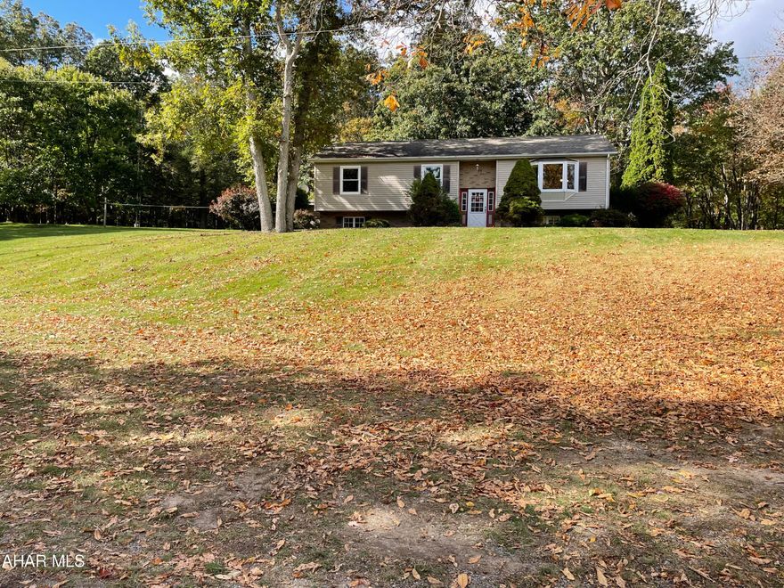 A unique property.... Spacious 3 bedroom 2 bath split level home with a massive unfinished basement sitting on over 12 combined acres on three separate parcels.  You can enjoy all the wildlife that will roam on your acreage and use the massive former mechanics garage for endless possibilities. There is a nice flow to the home which is great for entertaining The kitchen dining and living areas are connecting, a large bay window allows natural light to shine in.  The kitchen is spacious and the appliances are included.  The dining area has sliding glass doors to a private covered patio area, great space to relax or entertain your family and friends.  A large full bath for guests is right off the main area.  There are two nicely sized bedrooms and a master bedroom with bath.  Newer bedroom windows and new hot water heater.  So much potential with this property. Garage measures with a laser on the inside 39x55'5.