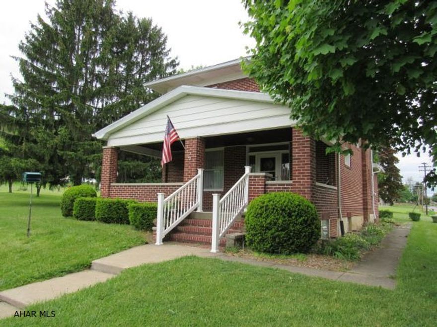 This bright, cozy 3 bedroom brick home includes 3 other parcels of land, all totaling 3+ acres of lush, private space and opportunity for growth. The home has been well maintained, and still retains its character of the 1920's era with beautiful beveled and stained glass windows on each floor, gorgeous original oak woodwork, solid wooden doors and plastered walls. All 3 bedrooms have roomy closets and the 2nd floor bath has a period claw foot tub /shower. The first floor features a convenient  bath, foyer, formal living room, dining room and an open kitchen, pantry/laundry room, and glass enclosed back porch. Enjoy watching the birds and the pleasant surrounding while sitting on your front porch, which always seems to have a nice breeze.