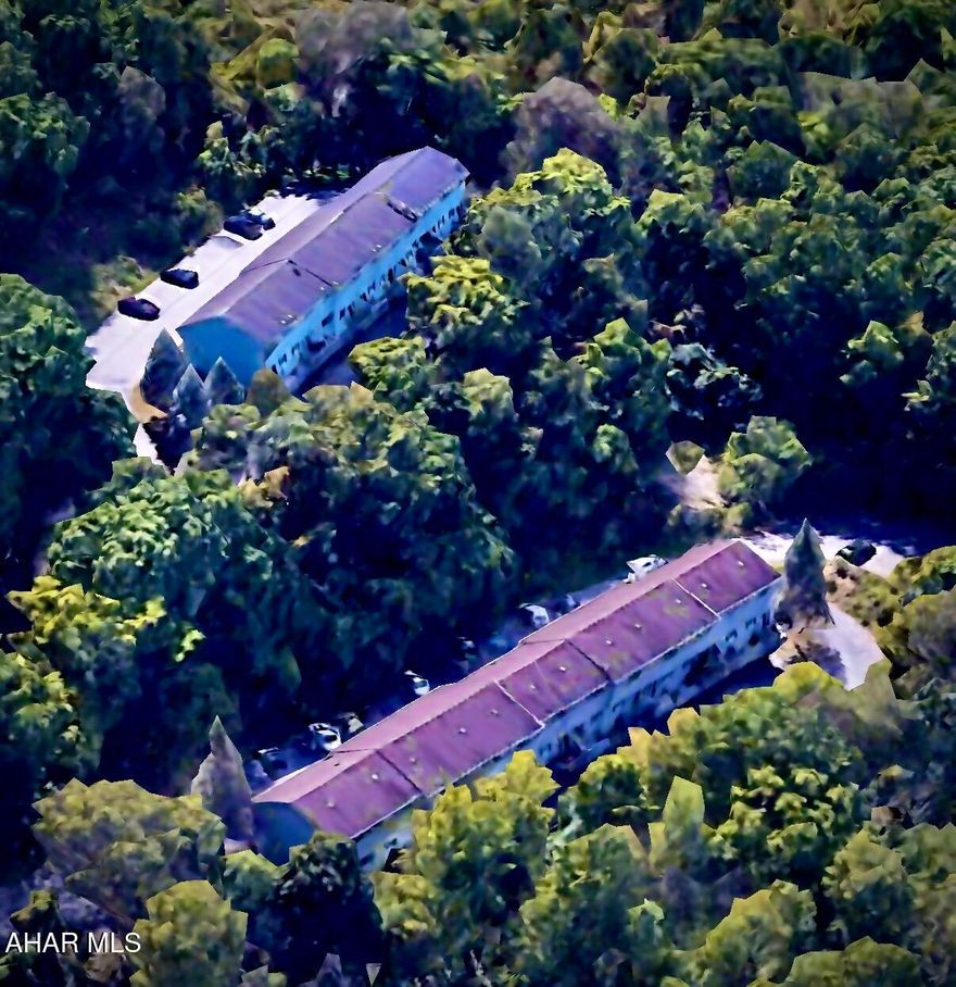 Welcome to Bel-Air Park Town Homes, a 22 unit residential investment property on 5.86 acres of land with quick access to 1-99 and 3.5 miles from downtown Altoona.  This unique property is tucked in its 5.86 acre tree covered hill side adjacent to Greenwood Park and includes both Ivan & WIll Lane, two multi-unit townhouse buildings.  Each townhouse has ground level entrances on both the first and second floors with its bedrooms and full bath on the third.  The second floor offers a living room, and balcony access off the kitchen/dining area with a garage or walk-out on the lower level first floor.  Both Ivan & Will Lane buildings provide plenty of off street parking and generous views of the PA Mountains.  Ivan Lane features a 10 unit building with nine Integral garages and a coin operated laundry facility as an option for all tenants.  Will Lane features a 12 unit building with four integral garages and eight ground level walk-outs which could potentially be converted into additional living space if desired.  Will Lane also includes an additional parking lot.  Bel-Air town homes offer private living and a turnkey value-add investment opportunity with quick access to I-99, downtown amenities and healthcare!  Units are updated when available and as needed, all units are occupied except one vacancy. Additional wooded acreage above both buildings could potentially be developed. The listing agent is related to the seller.