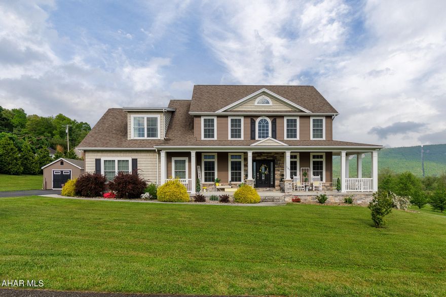 Has all the I wants! Home has beautiful view from front porch and back deck.  Yard is completely private with privacy fence, pergola...Kitchen open floor plan with H/W floors, breakfast counter, granite, eating area.  Living Room has Mendota fireplace. 1st floor bedroom, full bath, impressive foyer, office, 4 bedrooms, 2 full baths. 2nd floor - laundry, main bedroom, stunning bath. Concrete stamp patio.