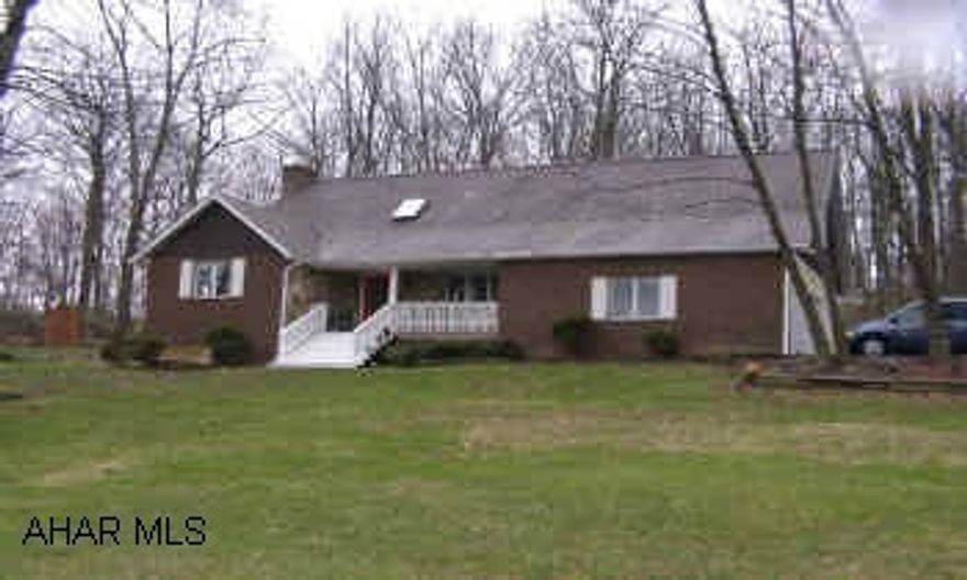 Stunning 3-4 Bedrooms/2.5 Bath 2 Story on Scenic Knoll Drive. This home is filled with pleasant surprises such as stained glass windows, hand crafted scenic panel in stair railing, jacuzzi bath tub on second floor,window seat, balcony and built-in bookcase in second floor bedroom, master bedroomwith sittng room that includes a vanity area, living room that has woodburning fireplace with hot air circulator and french doors that lead to 10x20 deck and hot tub. Basement is finished into a gorgeous bar/family room with cedarpaneling, propane.