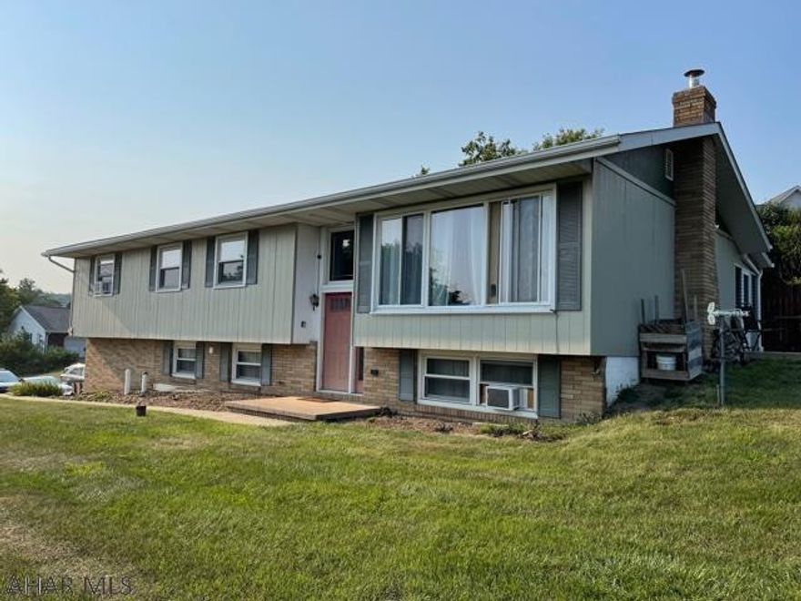 Enjoy the comforts of this newly renovated 4-5 bedroom home nestled in the town of Duncansville.  You will find hardwood floors in the upstairs bedrooms, laminate flooring in LR and DR, and carpeting in master and nursery. You wont be able to take your eyes off of the handmade concrete countertops in the kitchen, bath & bar area. There is an enclosed porch, fenced in area and lots of space to entertain! There are 2 garage doors however, 3 stalls to park cars. Call your agent to tour this property today!