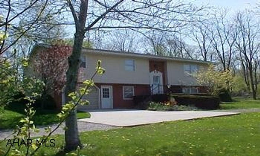 Rt 36S to Blinking Light at Smith Transport, L on Closson Rd, to T & turn R on Cove Lane, R onto Bailey Lane, go past Ponderosa Lane.  1st driveway on left.  Nice country setting.  2 small ponds, self-feeding rice coal stoker, .647 acres.  J-889  Taylor Twp.