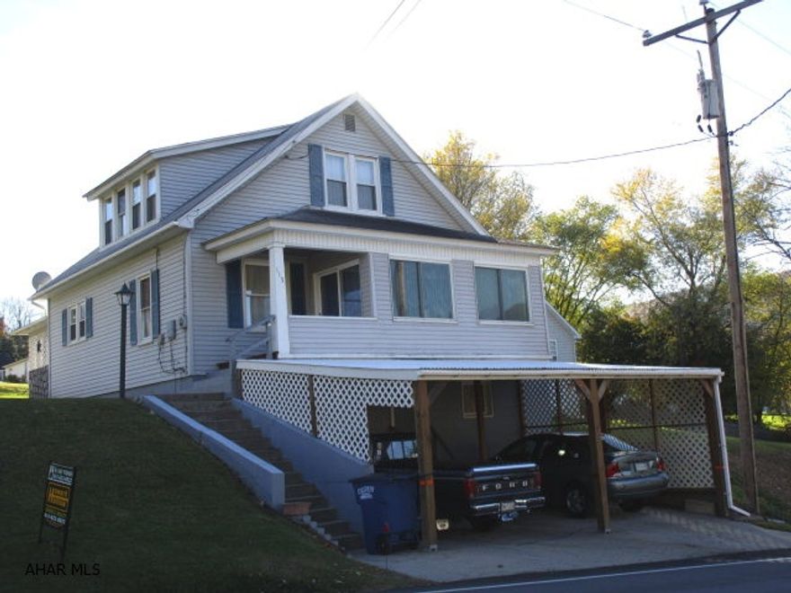 Cozy home with nice floor plan.  Lot extends from West 5th Ave. to back alley; spacious back yard.  Off-street parking + attached, 2-car carport.  Enclosed, finished front porch (no heat) with sliding patio doors to ft. porch + back porch + patio.   A good street-appeal property.  Convenient location.