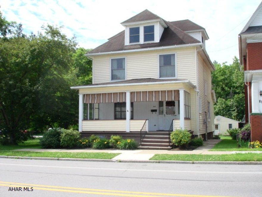 This 3 bedroom, 2 bathroom home offers large spacious rooms, natural woodwork, eat-in kitchen, lots of windows to fill the home with natural light, large bedrooms, walk-up attic that is finished and could be used as a fourth bedroom, a wonderful covered front porch, a huge covered concrete patio in the back, ample yard space, two car garage and shed.  There is an extra toilet and shower in the basement.  This welcoming home is just waiting for you!  Natural gas hot water heat.  Maintenance free exterior, great location move in ready.