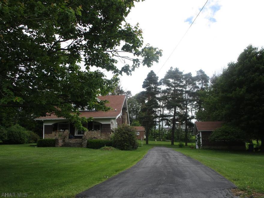 Remodeled 1.5 story home on a over 2.2 acre lot with beautiful lawn. Home features eat in totally remodeled kitchen with new cabinets, center island and fireplace, Beautiful living room with hardwood floors and oak trim, formal dining room, den and half bath. Bedrooms have walk-in closets, second floor bath is all new. Stone front porch with view. Detached garage and a separate 20x36+/-  barn/shop.New furnace installed. All new electric throughout the house. All but 2 new thermo-pane windows. Nice location and this home has much to offer!