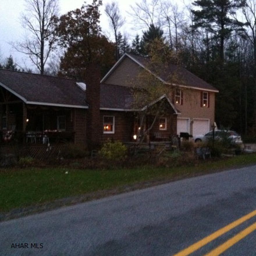 The one story was built in Mid to late 1970s. It has a beautifully decorated kitchen, dining and living room combination along with a bedroom , 2 baths baths and laundry.A Two car garage with above living area was constructed in approx. 2007. The above living area contains a family room, 3 bedrooms and loft area. There is oil and Hard coal hot water heat in the house along with a wood burner. Close to Prince Gallitzin State Park, Rock Run, State Game Lands and a trout stream in your back yard.