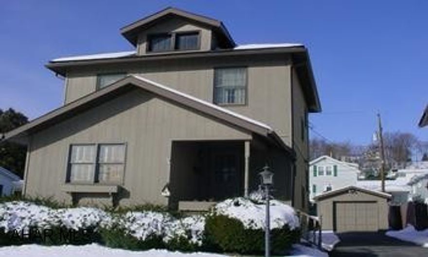 Sweet home in Pleasant Valley.  Sunporch off of living room.  1-car detached garage and fenced lot.  Decorate this one to your own taste!