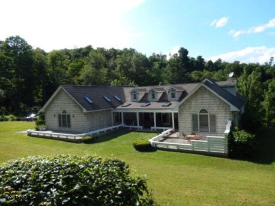 Unique custom built home on 1 1/2 Acre in Logan Township. Large Spacious rooms with plenty of natural light. New hardwood floors. Valuted ceilings and skylights. This lovely setting includes pond, waterfall, garden, shed, kids play park, pavillion, fire pit and more. 2car garage and plenty of extra parking. A must see!! Air condioning is a heat pump system. Fireplaces are Propane.