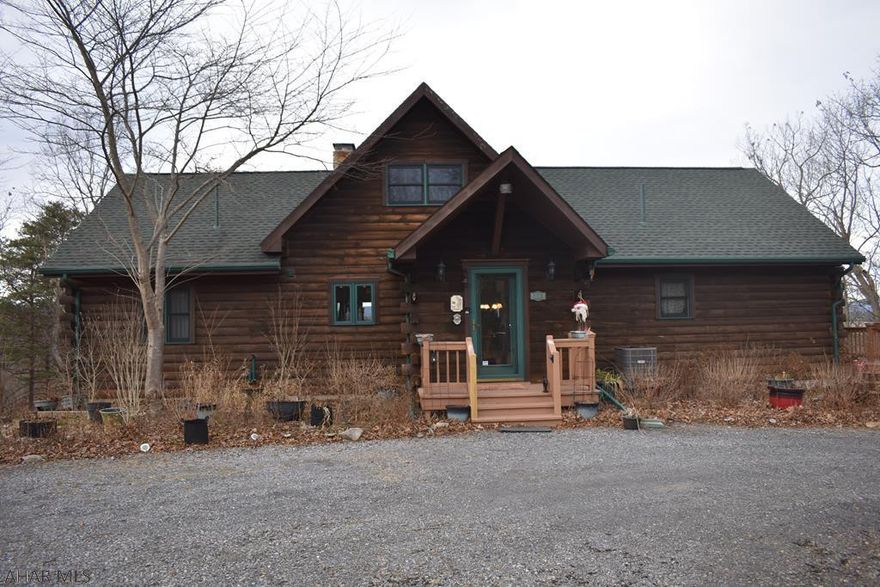 Looking for privacy and one floor living?  This is the home for you.  This well maintained A Frame home sits atop a hill with great views.  The home features three bedrooms and two full baths on the first level and a possible fourth bedroom in the finished basement.  The walkout basement also includes a sauna, workshop, and full bathroom.   There is a beautiful wood burning fireplace on the first level and a wood burning stove in the basement to warm you up after a day of skiing at Blue Knob (18 Miles) or Seven Springs (51 Miles).  The main living area has an open concept with wood floors, wood beam ceilings, and granite countertops.