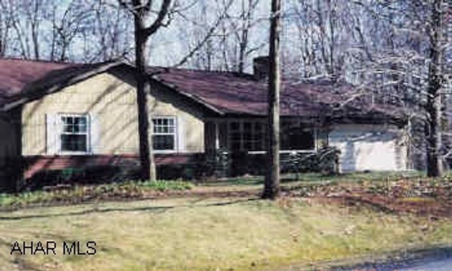 Rancher with 5.69 acres. Very peaceful, wooded. Fireplace in livingroom. Very well kept. New windows, roof and heating system