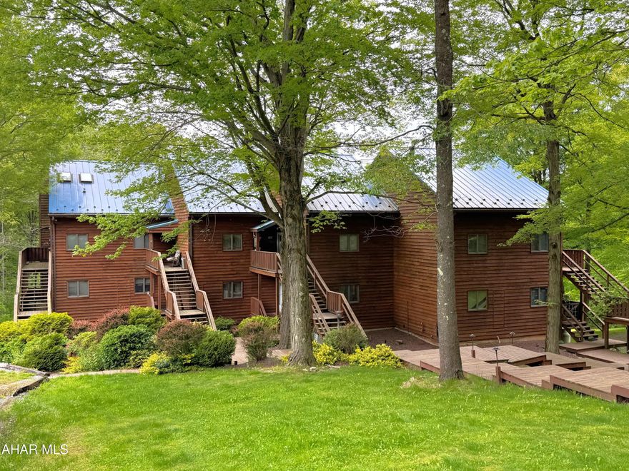 Beautiful, fully furnished condo in the heart of the PA mountains!! Just minutes from Blue Knob State Park and Blue Knob All Seasons Resort, this well maintained and move-in ready condo is ready for year-around living or your part time escape into nature and woodlands. Enjoy hiking, skiing, snow tubing, golf, or just relax and watch the wildlife. The main level offers an entry foyer, great room with vaulted ceiling and fireplace, kitchen with corian counters, a cozy breakfast nook, and a full bathroom complete with a stack washer and dryer. The second level has a large bedroom and half bathroom. Updated oil forced air furnace and new paint throughout. This condo also features a one-car carport and parking for additional vehicles. Make this your new home or vacation getaway!!