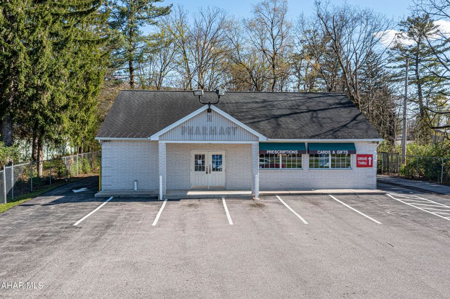 Commercial building in Altoona's Greenwood/Bellmeade area, formerly a pharmacy, spans 1680 SF, featuring a drive-through window. Located in a high-traffic area opposite Sheetz, it sits on a large 0.83-acre lot in Logan Township. Conveniently near I-99 exits Pinecroft and Kettle Street.