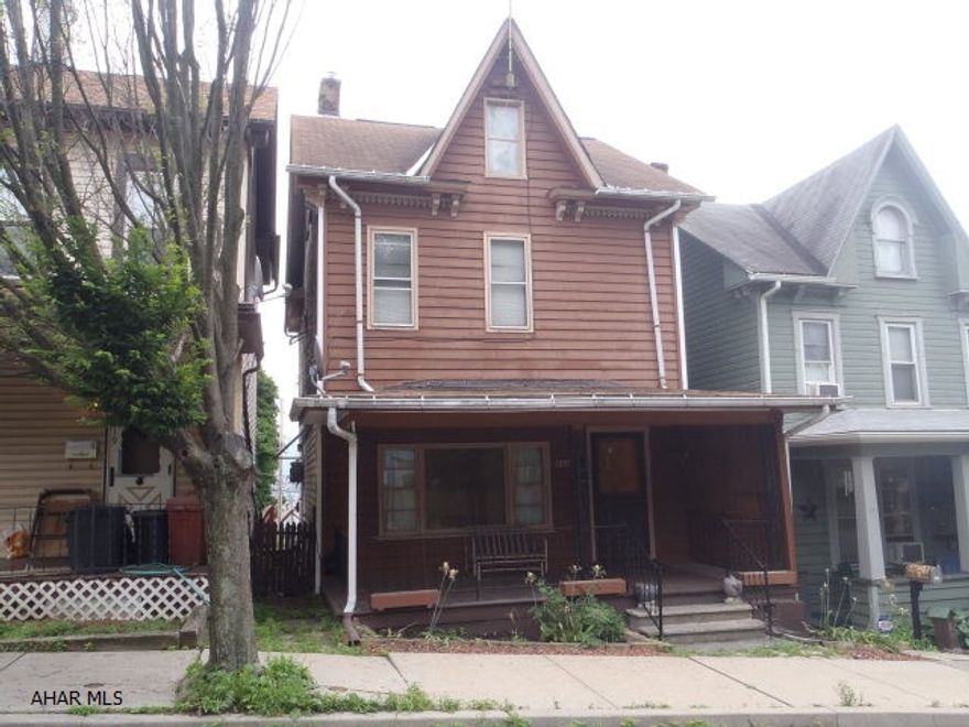 Newer roof and GFA furnace.  Knotty pine walls in living room and dining area.  Huge bathroom.  Covered front porch.  Walk up attic for storage.  Gas fireplace in living room has been disconnected.  Vinyl siding in basement to finish side of house.  Owner will consider reasonable offers.