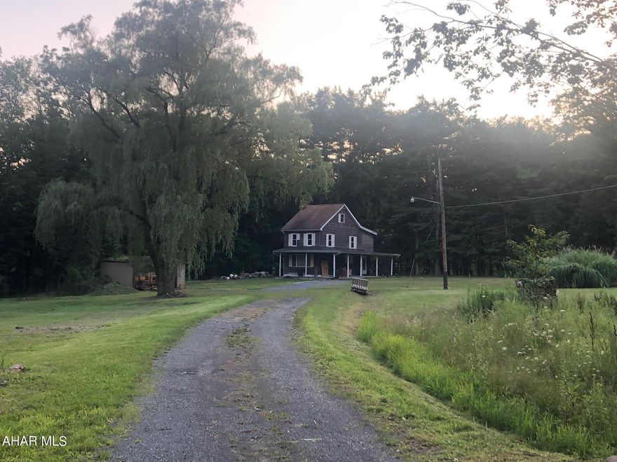 This home sits at the end of a private drive on just under 9 acres and small stream. Offering 2 bedrooms, 2 bathrooms, first floor laundry, and a walk-up attic that could be an additional room. This house would be perfect to make a forever home with privacy galore. Home needs new septic and well. Will not qualify for most forms of financing.