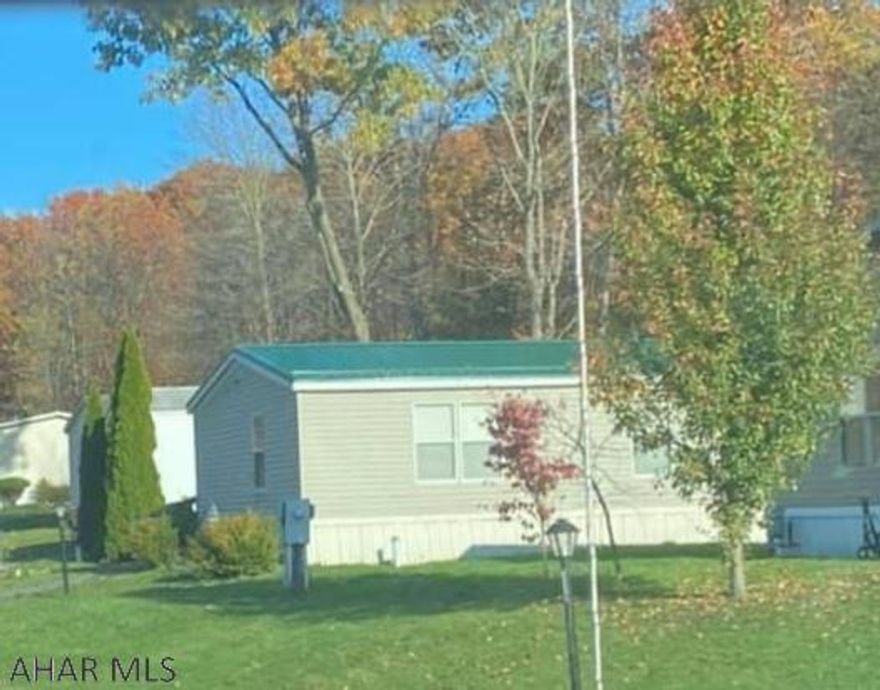 Large 3 bedroom 2 bath mobile home in Camelot Woods Mobile home park.  New metal roof with 50 year warranty installed in 2020. Lot rent $368/montj which includes sewer, trash, and road maintenance. The large master suite has a full bathroom and new flooring. The kitchen leads to the dining room, living room and family room offering nice open entertaining. Home is complete with 2 additional bedrooms and a full bathroom. Call listing agent for more information. Approval by Camelot Woods required to close.