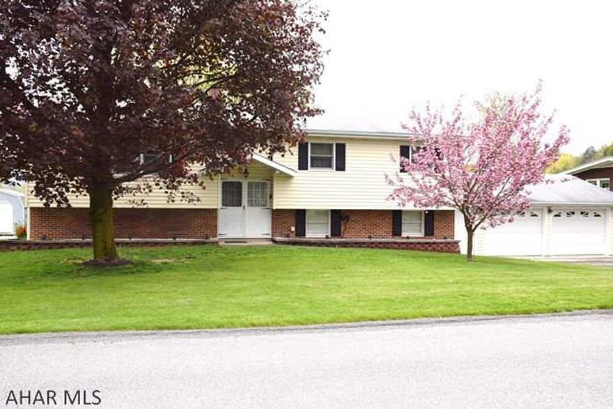 This comfortable, over-sized bi-level is just what you've been looking for in the Bellwood School District.  Situated on a large level lot, the home features a family room with fireplace, central air conditioning, and a large bonus space in the lower level to use how you please.  The home has been very well maintained.  Truly a "move right in" home that has recently been professionally cleaned from top to bottom including all carpeting.  Home Warranty Included!!