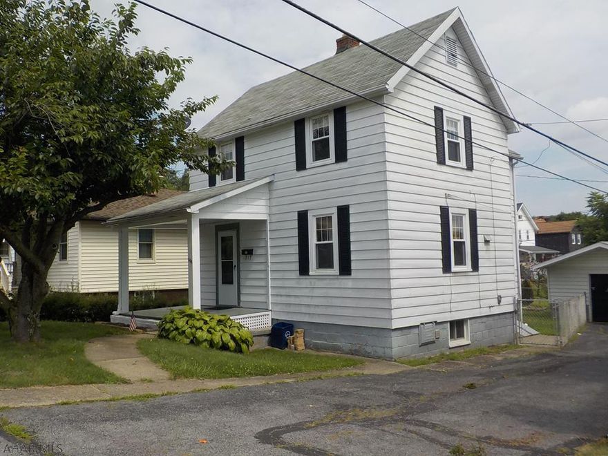 New kitchen & bath. New laminate flooring on main floor.  New carpeting upstairs.  Inerior freshly painted.  Small fenced in backyard. Detached garage.  Shared driveway.