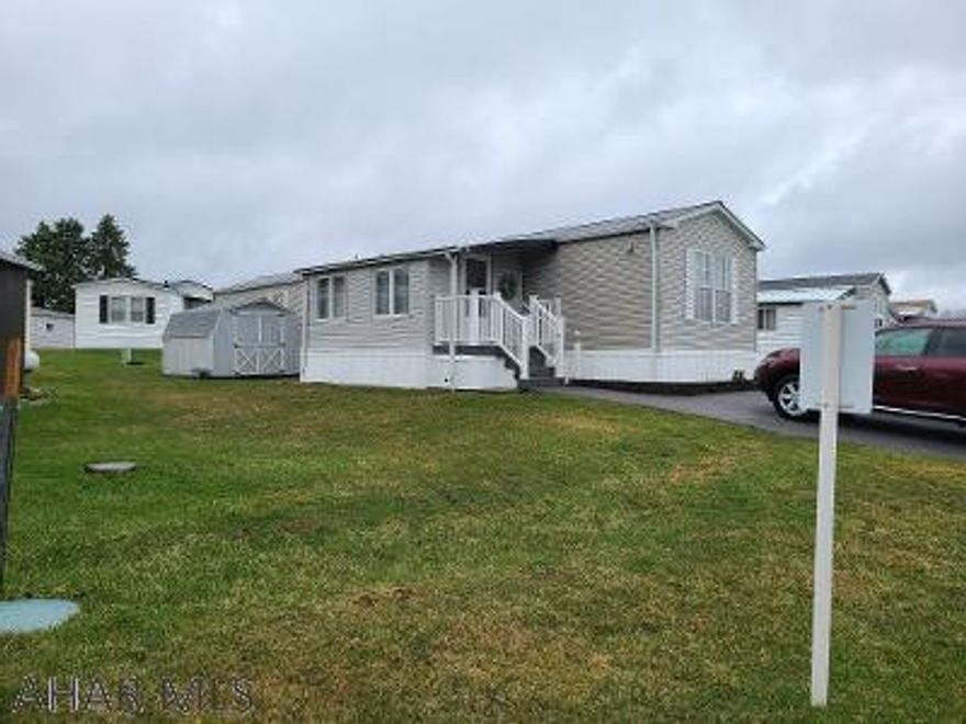 Very nice singlewide in the Wise Trailer Park in Ebensburg..across from the mini mall.  Features include a bright sunroom, central air, newer roof and furnace, a backup wall propane heater (no electricity required), and a large shed.  The lot rent is $230/month.  If you pay by the 5th of the month, you get a $20 discount.  The lot rent includes water, sewer and trash.  This is a 55+ community.  No dogs, but you are allowed 1 cat.  Very low taxes.