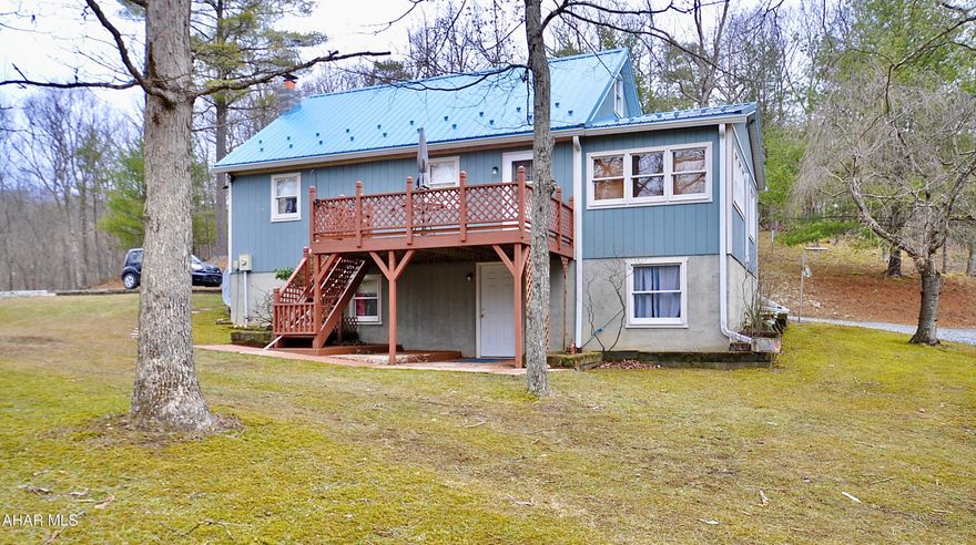 Wonderful hilltop cape style home on 5 acres! Lots of privacy, just minutes from Shy Beaver Boat Launch and beautiful Lake Raystown. This year round home has new metal roof, as well as 3 mini splits providing heating and cooling. There is also an oil fired hot air furnace. The full unfinished basement, dry as a bone, walks out to grade. Neat as a pin and ready to move in. Priced to sell do not wait!