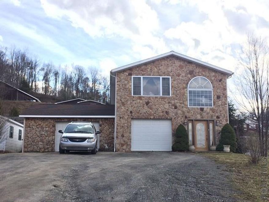 This large beautifully maintained 4 bedroom 3 1/2 bath home sitting on 3 lots is perfect for entertaining family and friends. The spacious open kitchen/dining area with 2 stoves, 2 sinks and 2 islands is a chef's dream. Step off of the sunroom and enjoy the inground pool with pool/guest house with 1/2 bath. This home has large bedrooms and a master bedroom suite with a walk in closet. If you are looking for a home office space, this property will not disappoint with 900 square feet and a separate entrance. There are many spaces in this house that are not completed, you can imagine the possibilities.  New Windows and furnace, radiant heat in the floors with 6 zones.  Must see!