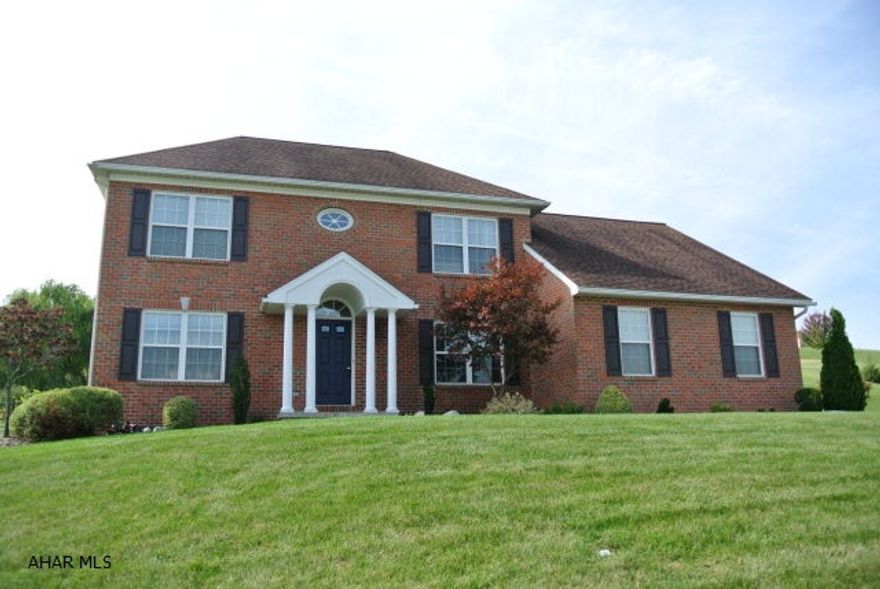 Well maintained brick & vinyl 2 story with a great view. Freshly painted interior. Updated light fixtures. Enjoy the deck & patio. Watch the deer & butterflies. New hardwood installed in family room. Extra bonus room could be a home office or library. Easy access to schools & shopping. Situated on a cul de sac...no traffic.  Seller is motivated....