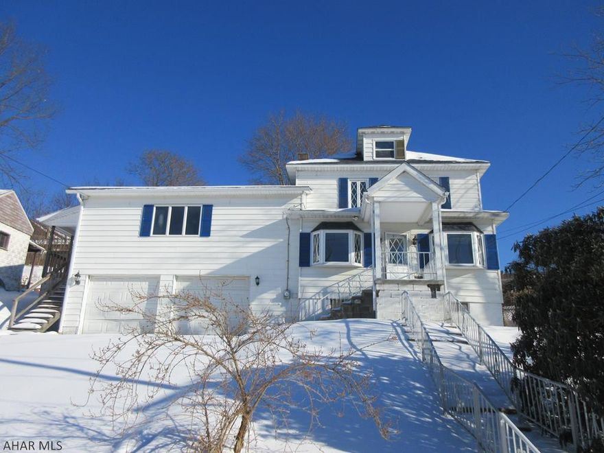 Large Nanty Glo 2 story home includes nice 1 bedroom apartment above 2 car attached garage (w/ separate heat and electric). Main house features large living room, formal dining room, eat-in kitchen, 3 bedrooms, 1 bath, 2 enclosed porches. Apartment above 2 car garage is 1 bedroom, living room/dining combo, kitchen and full bath for separate living quarters (not zoned for multi-family use). Property needs some work, but could be perfect for the right buyer. AS-IS sale. Seller will make no repairs.