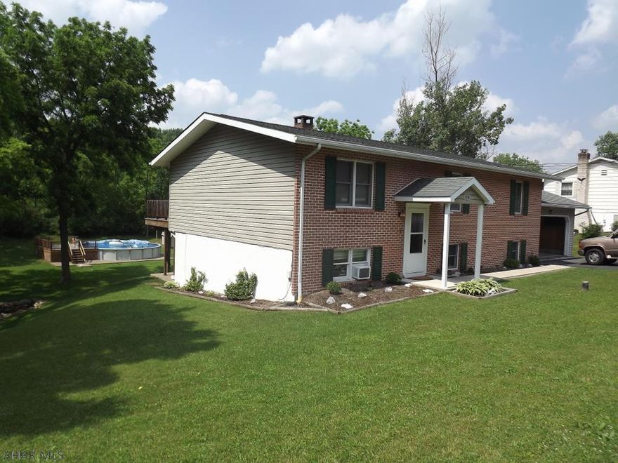 Don't miss this 5 bedroom split entry home situated on a nice .46 acre lot with an above ground pool. Large deck and patio overlooks the private back yard. Two car attached garage.  New energy efficient windows and doors. This home is kept toasty warm in the winter with a Harman pellet stove as a secondary low cost heat source. Call listing agent today.