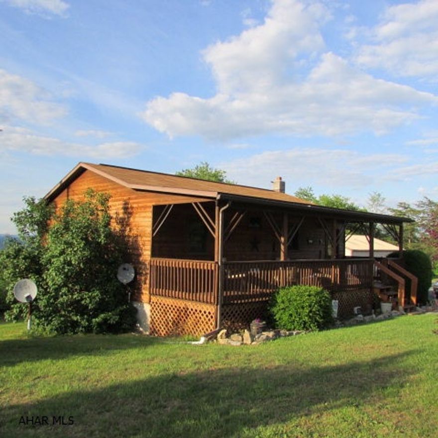 Great getaway on two acres w/incredible views & large garage for boats! Perfect for outdoor living, this home boasts a private 10x32 deck at back for absorbing the scenery; an above ground 16'; 8x32 covered porch at the front. You enter the home from the covered porch into the kitchen & large dining area w/access to the deck. The main area also has full bath & 2 BR's. The lower level features large living/family area plus another nice-sized room currently used as bedroom. Very low utilities-275 gallons of fuel this past winter. The large 30x40 Morton-style garage has 200 amp service, separate meter, 8x10 doors. Centrally located - 7 miles to Seven Points; 6 miles to Snyders Run boat launch; MOTIVATED SELLERS - BRING ALL OFFERS!!