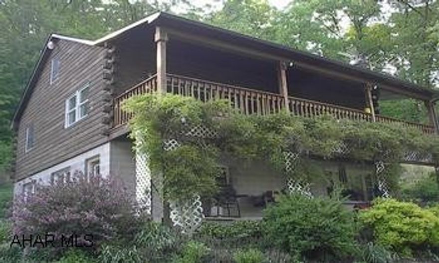 FAMILY HOME OR RETREAT!  SECLUDED 5.88 ACRES. 3-4 BDRM LOG HOME OVERLOOKING POND AND GARDENS.  MINUTES TO ALTOONA OR STATE COLLEGE AND GAME LANDS.  LOWER LEVEL FINISHED WITH BATH & 2ND KITCHEN FOR SEPARATE QUARTERS OR ENTERTAINING. FAMILY HOME OR RETREAT!  SECLUDED 5.88 ACRES. 3-4 BDRM LOG HOME OVERLOOKING POND AND GARDENS.  MINUTES TO ALTOONA OR STATE COLLEGE AND GAME LANDS.  LOWER LEVEL FINISHED WITH BATH & 2ND KITCHEN FOR SEPARATE QUARTERS OR ENTERTAINING.  LG. 2-CAR GARAGE WORKSHOP.  COULD BE NICE FOR HORSES.  MAIN LEVEL HAS MASTER BDRM AND LAUNDRY.  QUALIFIED BUYERS.  CALL DARLA, 934-4663 OR DARLA4HOMES@AOL.COM.  NO DRIVE BYS!