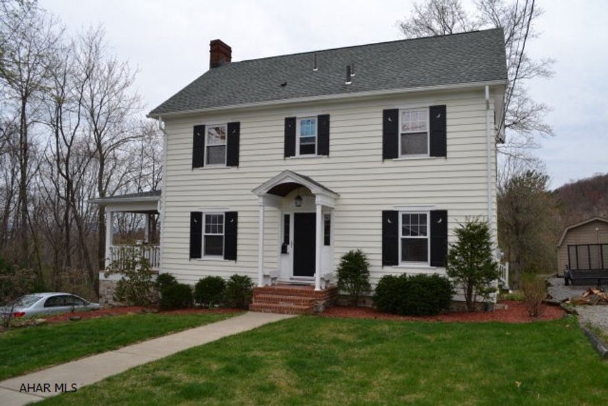 GREAT PRICE in a GREAT LOCATION! Charming 2-story colonial with 3BR's, 2 baths located just before the entrance to Beverly Hills Dev.  Everything has been done including updated kitchen and bath, beautiful new side porch with custom outdoor HW floor, new doors, insulation, 200 amp service, newer roof, water/sewer lines and attic pull down steps.  Exterior just recently painted with new custom shutters.  Just move in and enjoy the view from the amazing new porch or there's another screened porch in the back.  This beauty sits on 3 parcels. Within minutes to UPMC Altoona and PSU Altoona Campus.  New price is below recent appraisal