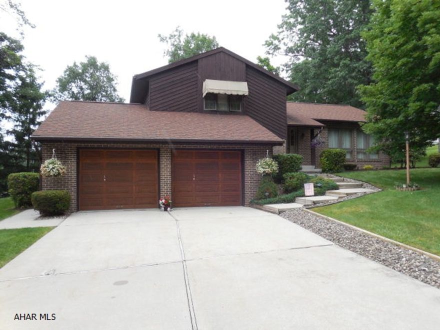 Brick & Cedar Contemporary multi-level on Cedar Street. The one with the attractive Cedar garage doors.   Custom built by Brian Hetrick in 1990.  Three levels of comfortable living on a gorgeous street close to everything.   First level sunroom for year around enjoyment.  Cozy family room with gas fireplace.  Oak kitchen with rich laminate flooring.Large private deck off the dining room for entertaining.  A truly unique property on a street that says it all.
