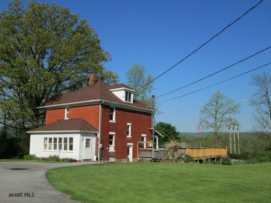 Hollidaysburg Schools!  Check out the all brick, 4 bedroom with 2 baths.  If you want quiet, private, and room to roam, this is it!  This classic brick features new windows, new roof, updated eat-in kitchen and large room sizes!  The great views from the deck are free!