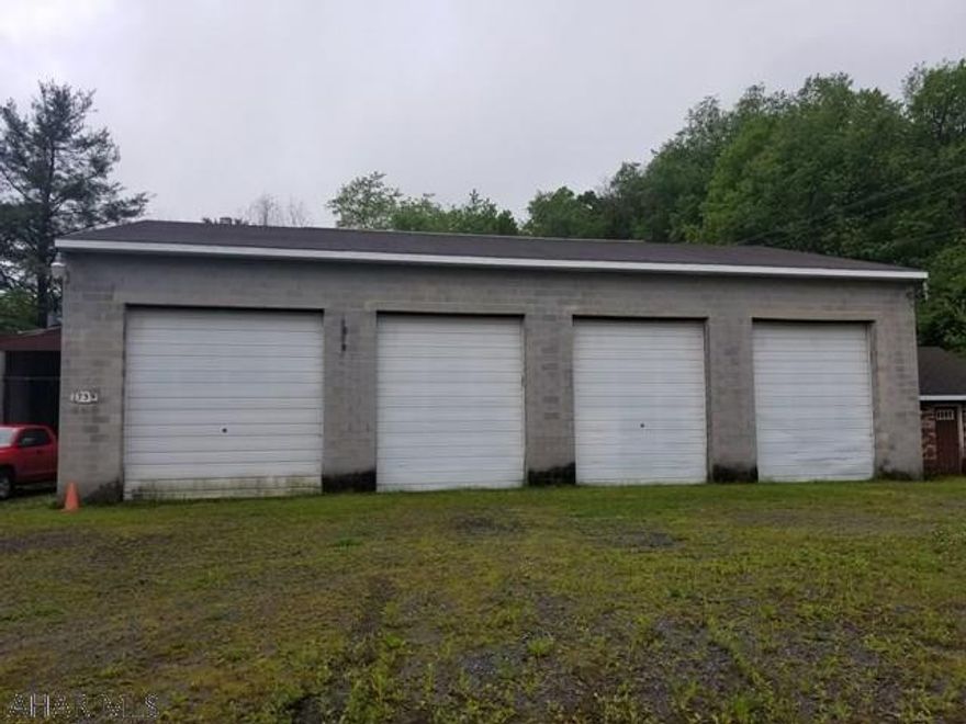Excellent location for business, auto service center, ware house, boat & RV storage or let your imagination run wild. The start of a large storage unit complex is in place, with plenty of room to expand. Small attached building could easily be converted into office space. Owners will consider an article of agreement for qualified buyer.