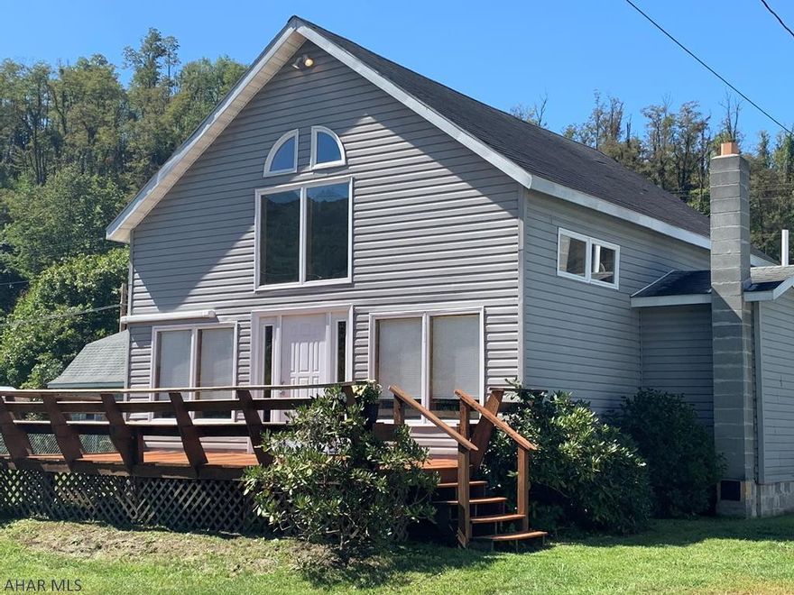 FALL in love with this unique a-frame home!  Step inside and admire the beautiful wood interior and the entrance of all the natural light.  Vaulted ceilings, lots of windows, and great indoor/outdoor space.  Large kitchen with an eat in kitchen flowing right into the spacious livingroom.  Full bath and bedroom on the first floor.  Enter up the staircase to the bonus room/office and master bedroom/master bath.  Enjoy your pumpkin latte on your front deck with wrap around bench or your back deck with a fenced in yard.  Detached garage and off street parking.  Walking distance to the bank, grocery store/deli, restaurants and much more!  30 minute drive to Bedford and close to MD line.  A Hyndman must see!!! Be prepared to FALL in love with 2931 2nd Ave today!