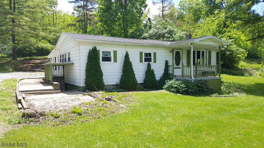 Doublewide, manufactured home in Northern Bedford School District.  What a great price for a home on 2.5 acres.  Convenient one-story living.  Beautiful, updated bathroom.  Roof and windows have been replaced.  Heat pump for efficient heating and cooling. Lots of garage space.  Beautiful country setting.  Borders Iron Masters Country Club.  Being sold "as is".