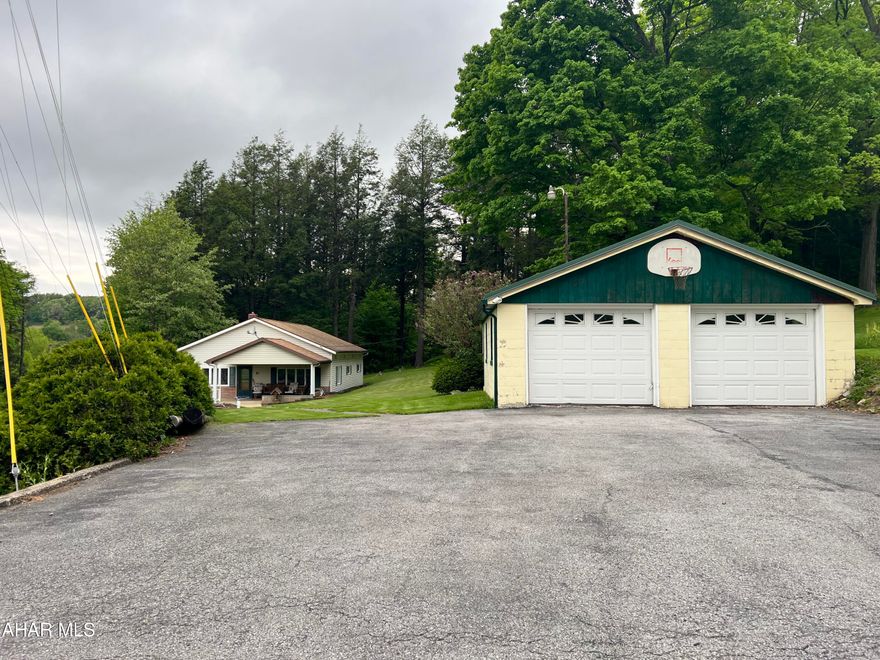 Great country location near Carrolltown.  3 bedroom rancher on 4.8 acres. The home contains living room, eat in kitchen, den, 3 bedrooms and 1.5  baths. Full unfinished basement. Detached two car garage with paved drive. This home has new floor coverings and offers nice wooded acreage for your privacy.