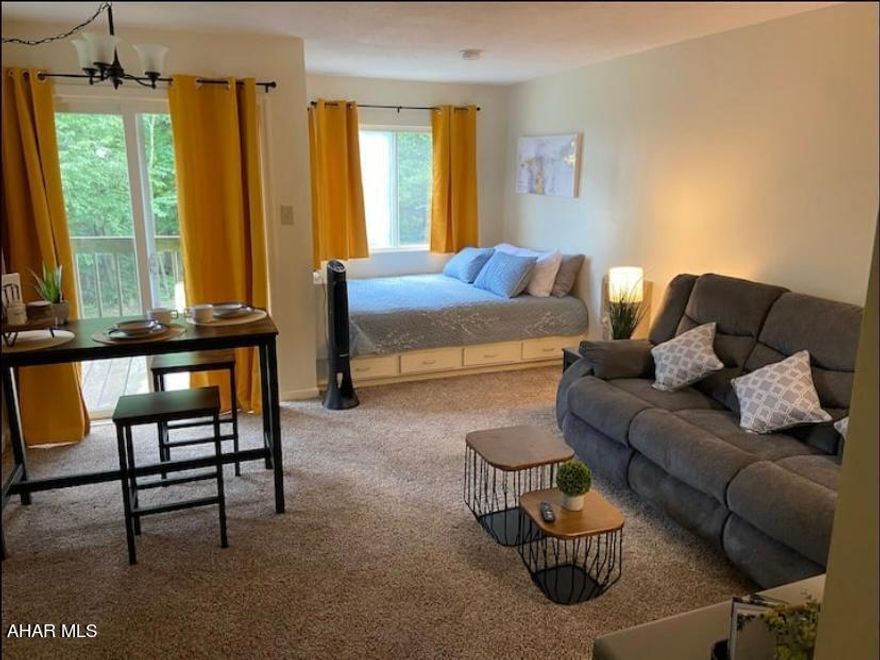 A perfect weekend or vacation getaway, or use as an investment.  Modern and cozy 1 bed 1 bath studio completely turnkey condo.  Located on the second floor of the complex, this unit was well loved and maintained.  The unit was also used as a short term rental investment property, grossing $15k annually for full year 2022.  New electric fireplace installed in 2023 ensures unit is up to HOA/insurance code.  Newly installed over-range microwave  All furniture, newly purchased dual reclining couch, bed, smart TV, linens/towels, fully equipped kitchen items convey.  Also included are digital, WiFi enabled entry door lock and digital, WiFi enabled video doorbell camera.  Deck balcony overlooks indoor pool, hot tub, and recreation facility and courtyard.  Free, onsite parking.  On property hot tub, indoor pool, outdoor pool, tennis and pickle ball courts, access to hiking trails, coin operated laundry, and golf course/restaurant.